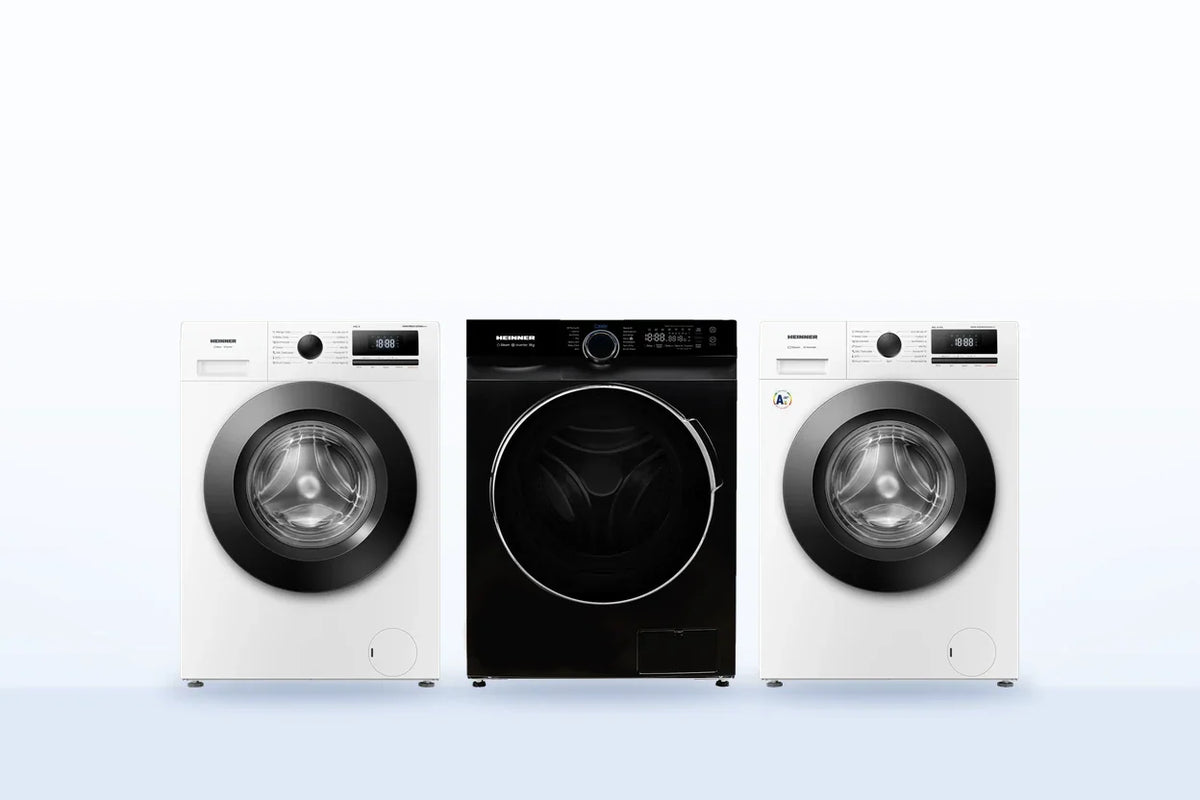 Drie Heinner wasmachines naast elkaar